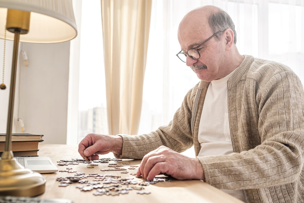 senior man working on a puzzle